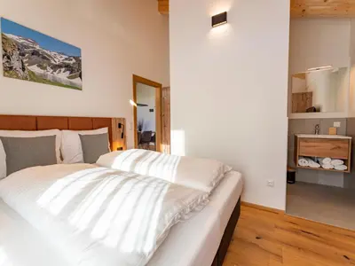Ein Bett oder Betten in einem Zimmer der Unterkunft Grebenzen Eiszeit Lodge