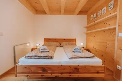 Ein Bett oder Betten in einem Zimmer der Unterkunft Chalet Aconitum
