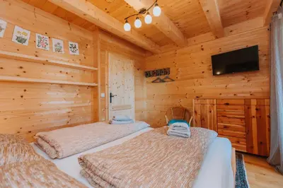 Ein Bett oder Betten in einem Zimmer der Unterkunft Chalet Aconitum
