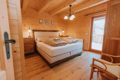 Ein Bett oder Betten in einem Zimmer der Unterkunft Chalet Aconitum