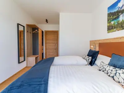 Ein Bett oder Betten in einem Zimmer der Unterkunft Chalet Kolibri