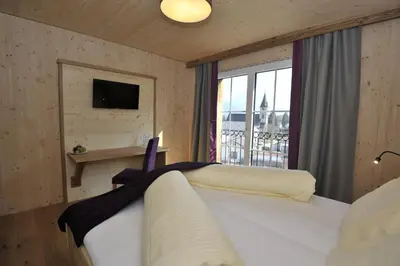 Ein Bett oder Betten in einem Zimmer der Unterkunft Das Dorfhotel Engl-Grafinger