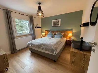 Ein Bett oder Betten in einem Zimmer der Unterkunft s'Manggei Gosau