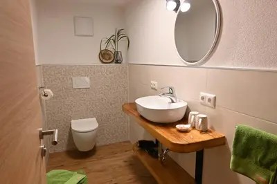 Ein Badezimmer in der Unterkunft Biohof Auinger, der Tiererlebnishof