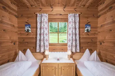 Ein Bett oder Betten in einem Zimmer der Unterkunft MOUNTAINRANGER - Lodge - ski in & ski out