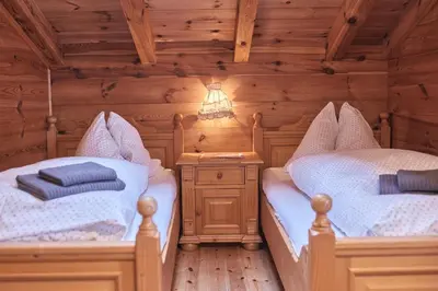 Ein Bett oder Betten in einem Zimmer der Unterkunft MOUNTAINRANGER - Lodge - ski in & ski out
