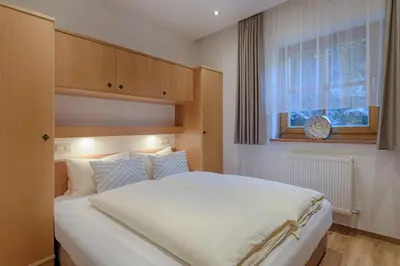 Ein Bett oder Betten in einem Zimmer der Unterkunft Apartments - Pension Florian
