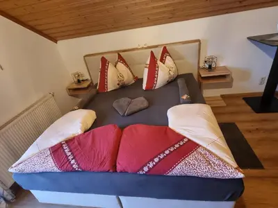 Ein Bett oder Betten in einem Zimmer der Unterkunft Urlaub am Bauernhof bei Familie Steinbrecher