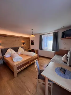Ein Bett oder Betten in einem Zimmer der Unterkunft Haus Alpenglühn