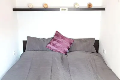 Ein Bett oder Betten in einem Zimmer der Unterkunft Untersee24 - Lake Hallstatt Apartment