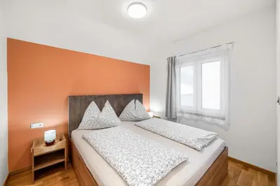 Ein Bett oder Betten in einem Zimmer der Unterkunft Hallstatt Lakeside Top 6 - Zimmer mit Balkon