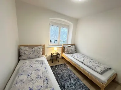 Ein Bett oder Betten in einem Zimmer der Unterkunft Ferienwohnung Niederthalheim