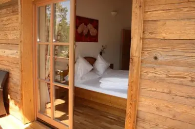 Ein Bett oder Betten in einem Zimmer der Unterkunft Landsitz Fuschlsee