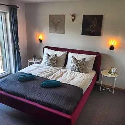 Ein Bett oder Betten in einem Zimmer der Unterkunft DAS TONIS - IHR Bett im Herzen des Salzkammergutes