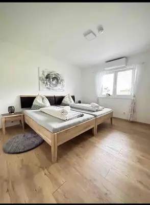 Ein Bett oder Betten in einem Zimmer der Unterkunft Resort am Winklfeld 8a