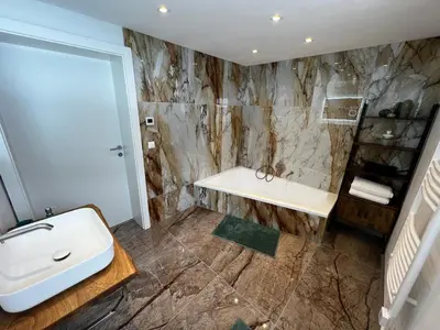 Ein Badezimmer in der Unterkunft Haus Bergfeld with the view over Dachstein