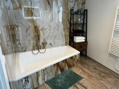 Ein Badezimmer in der Unterkunft Haus Bergfeld with the view over Dachstein