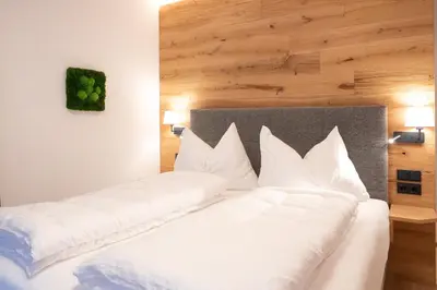 Ein Bett oder Betten in einem Zimmer der Unterkunft Salzkammergut Lodge