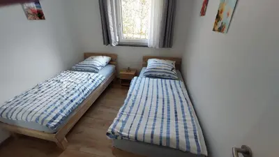 Ein Bett oder Betten in einem Zimmer der Unterkunft Ferienwohnung Claudia mit Terrasse