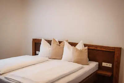 Ein Bett oder Betten in einem Zimmer der Unterkunft Hoamhaus