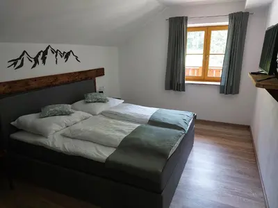Ein Bett oder Betten in einem Zimmer der Unterkunft Kesselmannhof in Faistenau