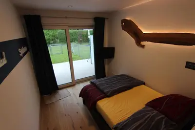 Ein Bett oder Betten in einem Zimmer der Unterkunft Ferien im grünen Reiterndorf