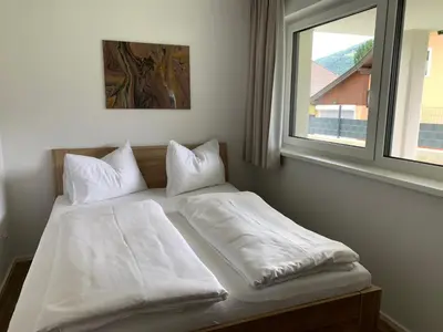 Ein Bett oder Betten in einem Zimmer der Unterkunft Ferienwohnung Siri Zentrum mit Garten