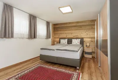 Ein Bett oder Betten in einem Zimmer der Unterkunft Neues Luxus APARTMENT DACHSTEIN - Ramsau am Dachstein - inklusive Sommercard!