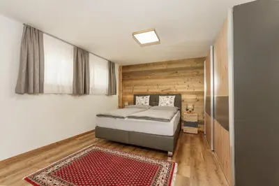 Ein Bett oder Betten in einem Zimmer der Unterkunft Neues Luxus APARTMENT DACHSTEIN - Ramsau am Dachstein - inklusive Sommercard!