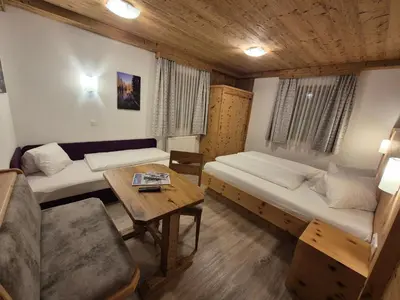 Ein Bett oder Betten in einem Zimmer der Unterkunft Apparthotel Kirchgasser