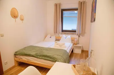 Ein Bett oder Betten in einem Zimmer der Unterkunft Gutshof zum Wurzgarten